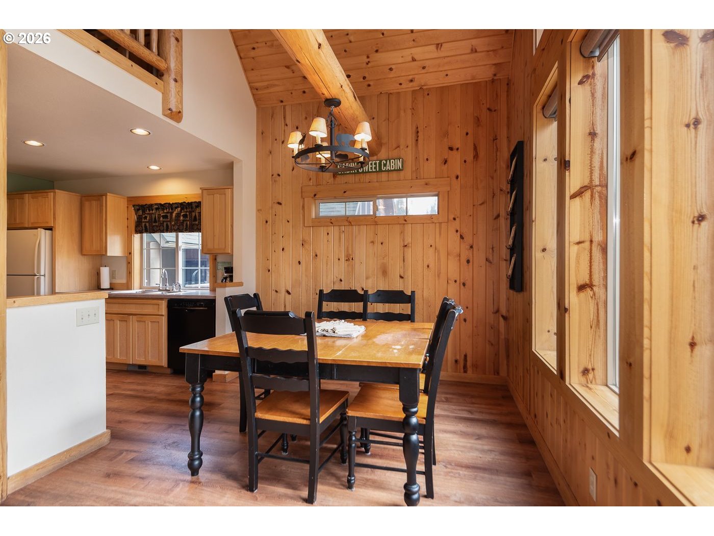 8968 Cliff Swallow Drive Redmond, OR 97756 - Photo 7 of 25 a view of a dining room with furniture and wooden floor
