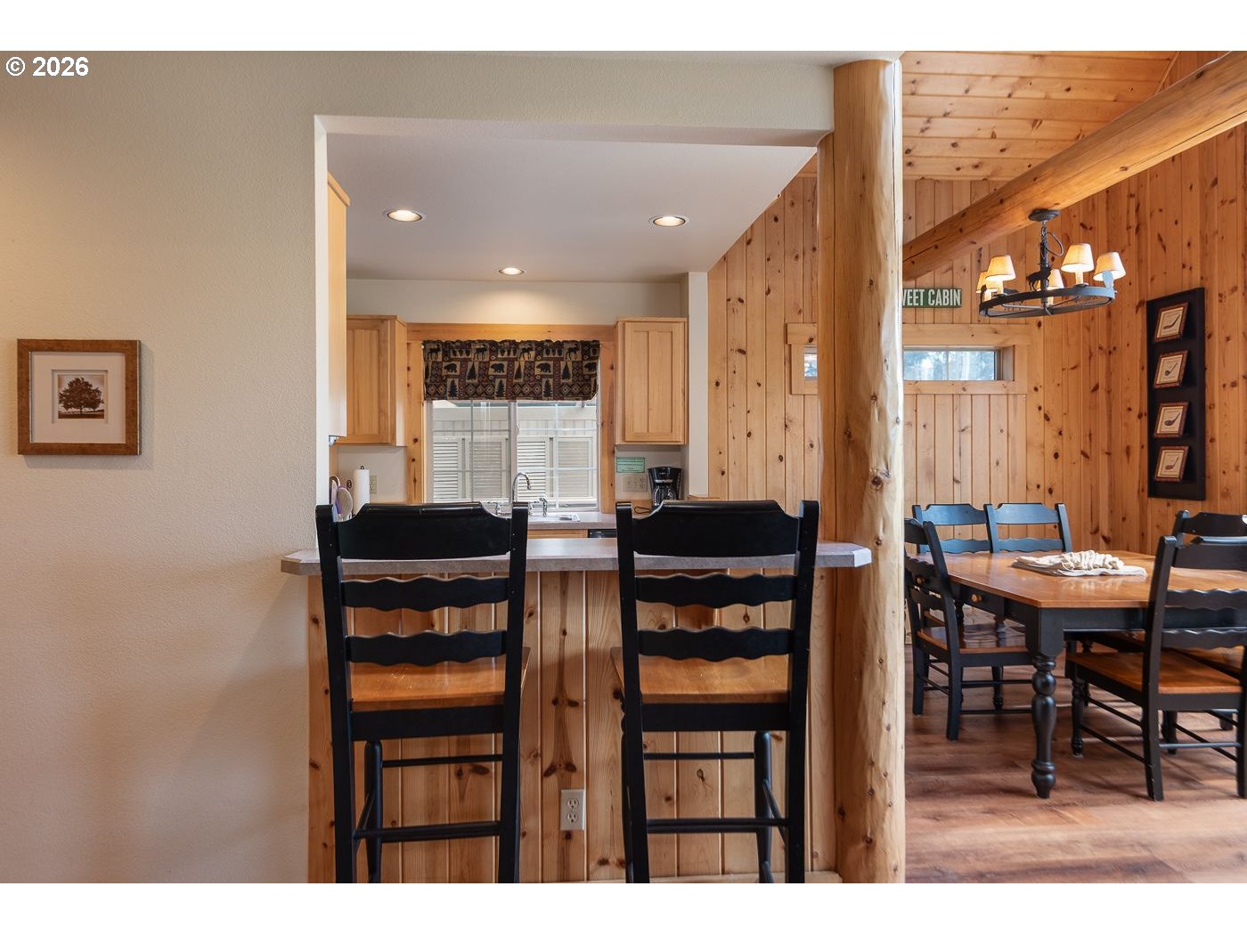 8968 Cliff Swallow Drive Redmond, OR 97756 - Photo 9 of 25 a view of a dining room with furniture and chandelier