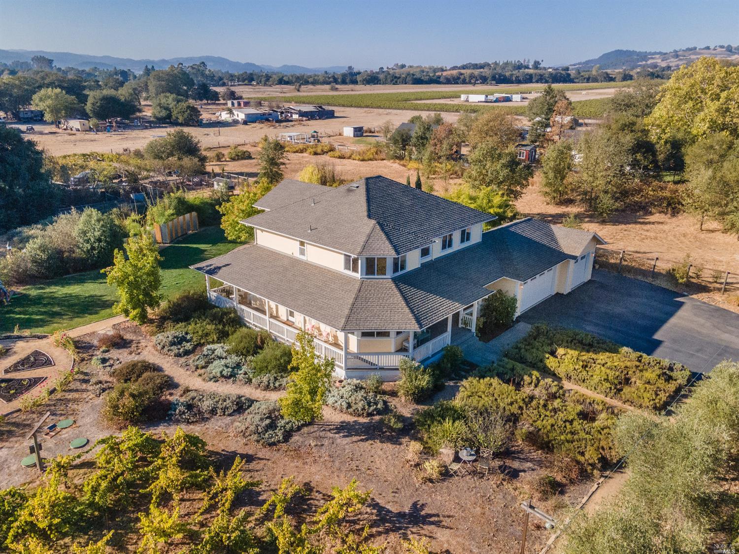 10377 Hillview Road Windsor, CA 95492 - Photo 1 of 1 an aerial view of a house with a lake view