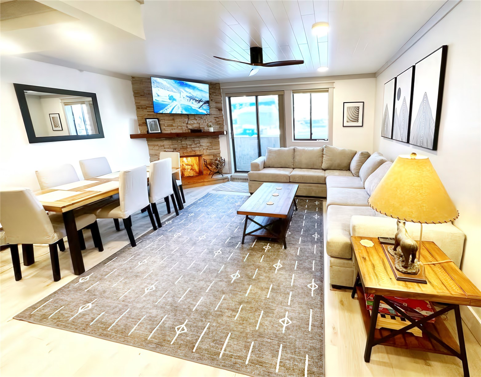 a living room with fireplace furniture and a flat screen tv