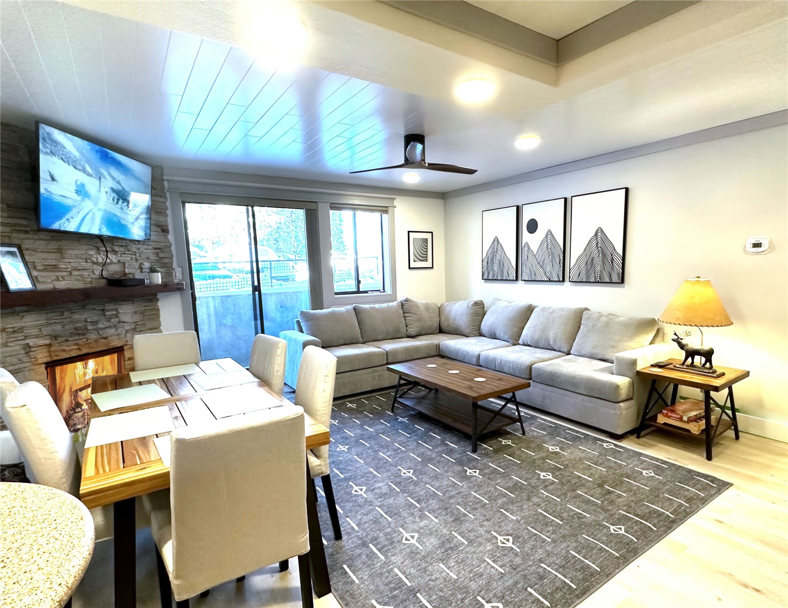 611 Village Road, Unit 21240 Breckenridge, CO 80424 - Photo 2 of 23 a living room with furniture and a flat screen tv