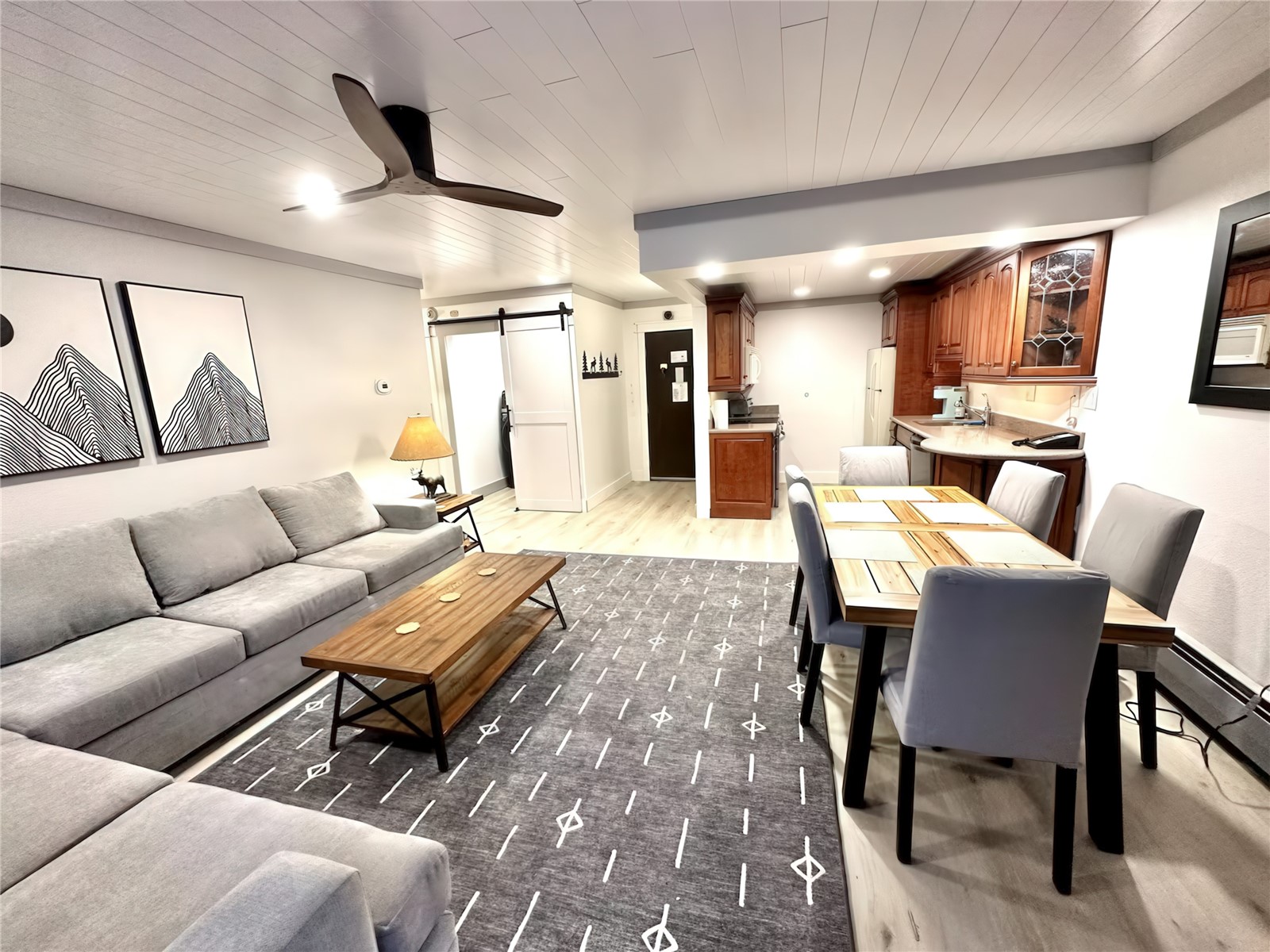 611 Village Road, Unit 21240 Breckenridge, CO 80424 - Photo 3 of 23 a living room with furniture and a wooden floor