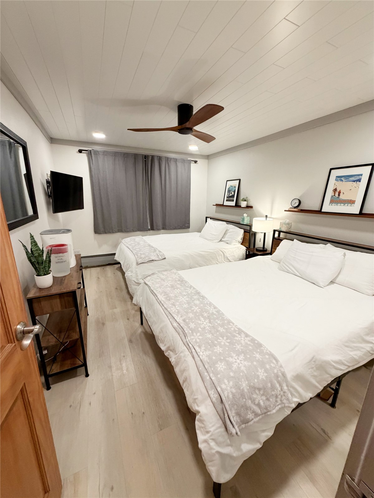 611 Village Road, Unit 21240 Breckenridge, CO 80424 - Photo 8 of 23 a bedroom with a bed and a television