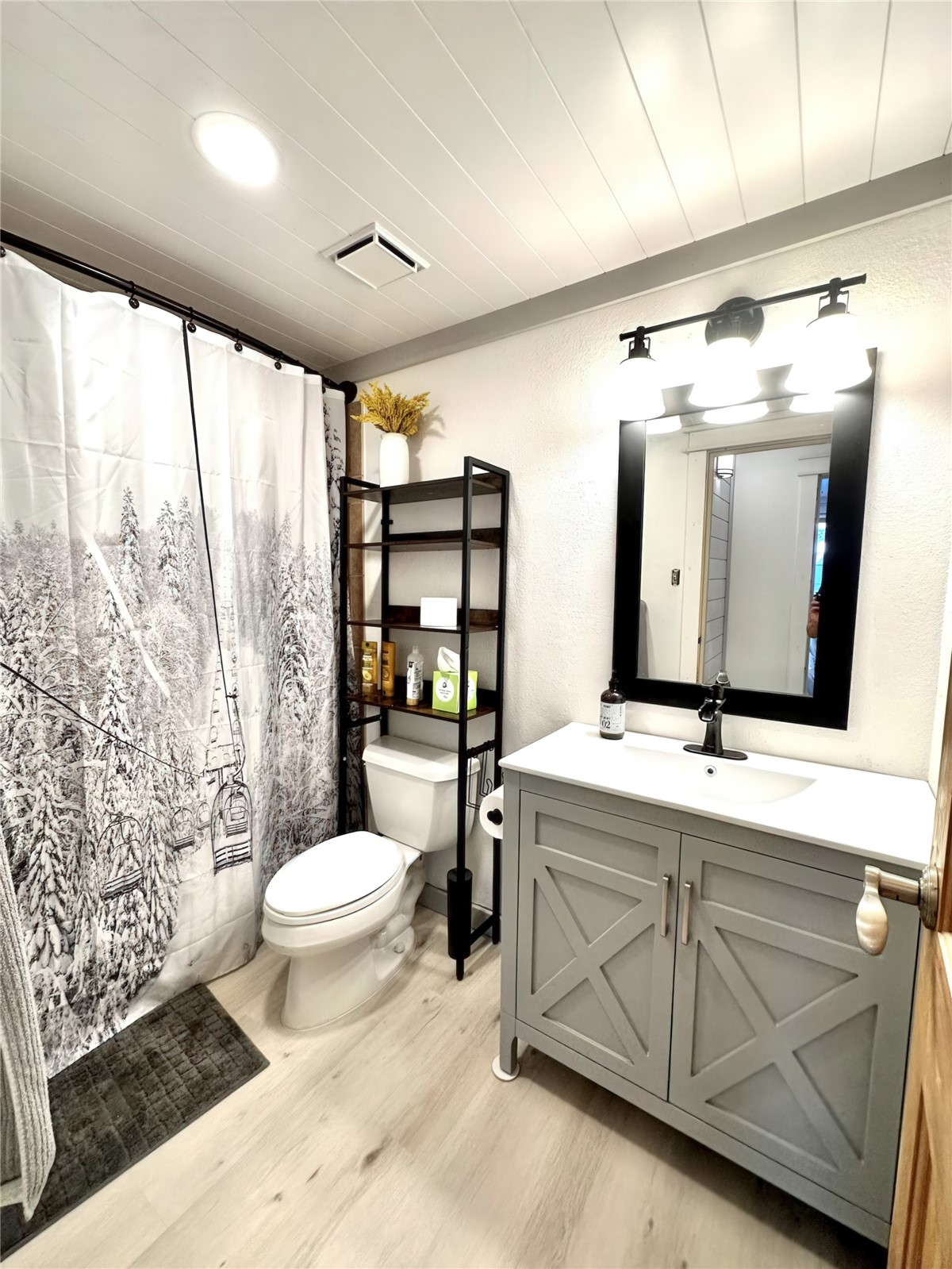 611 Village Road, Unit 21240 Breckenridge, CO 80424 - Photo 10 of 23 a bathroom with a toilet sink and mirror