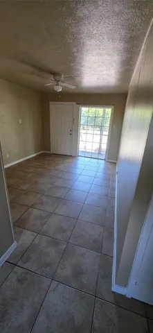 a kitchen with a cabinets and a refrigerator