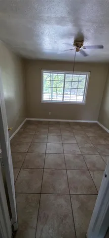 a kitchen with a cabinets and a refrigerator