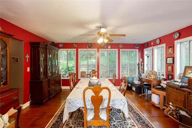 a living room with furniture a rug and a window