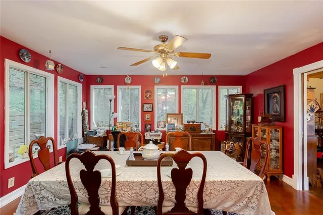 a living room with furniture flat screen tv and a window