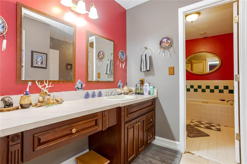8 Mt Sequoyah Road Jasper, GA 30143 - Photo 23 of 86 a bathroom with a sink and a mirror