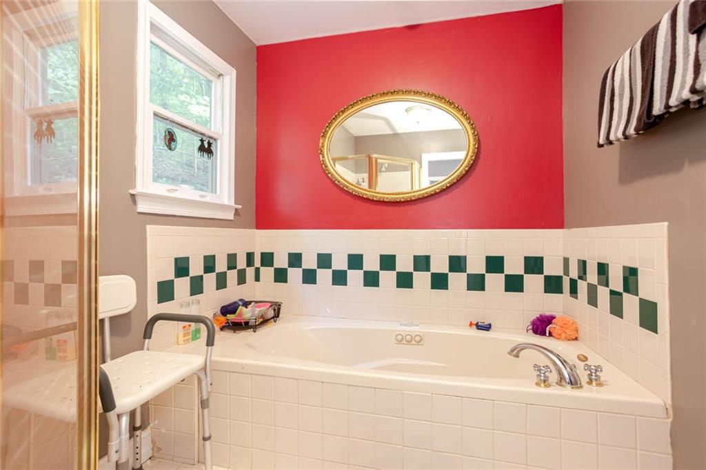 8 Mt Sequoyah Road Jasper, GA 30143 - Photo 24 of 86 a bathroom with a bathtub and a window