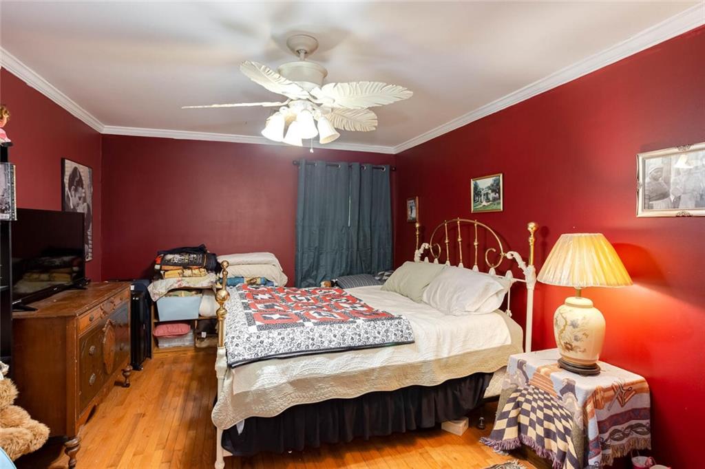 8 Mt Sequoyah Road Jasper, GA 30143 - Photo 30 of 86 a bedroom with a bed and a chandelier