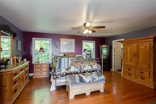 a view of a wooden door and a car parked side of it