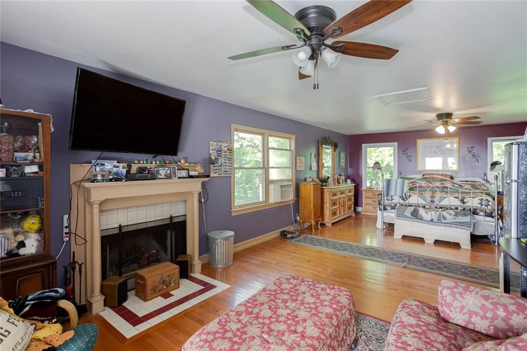 8 Mt Sequoyah Road Jasper, GA 30143 - Photo 39 of 86 a living room with furniture a flat screen tv and a fireplace