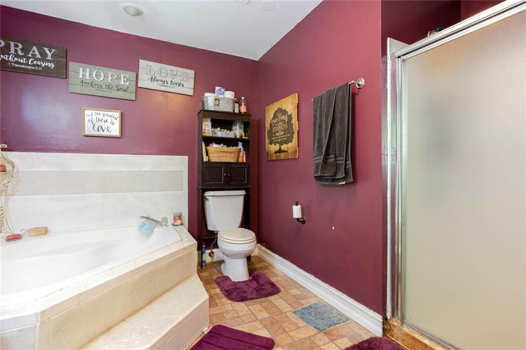 8 Mt Sequoyah Road Jasper, GA 30143 - Photo 41 of 86 a bathroom with a bathtub shower sink and toilet