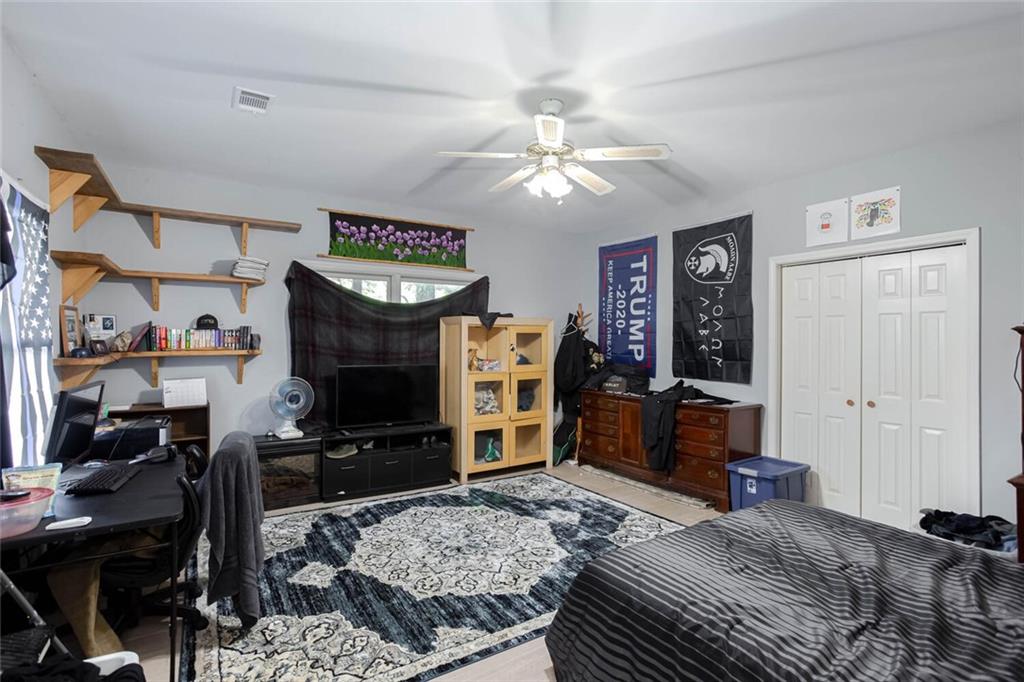 8 Mt Sequoyah Road Jasper, GA 30143 - Photo 45 of 86 a bedroom with a bed a dresser and flat screen tv