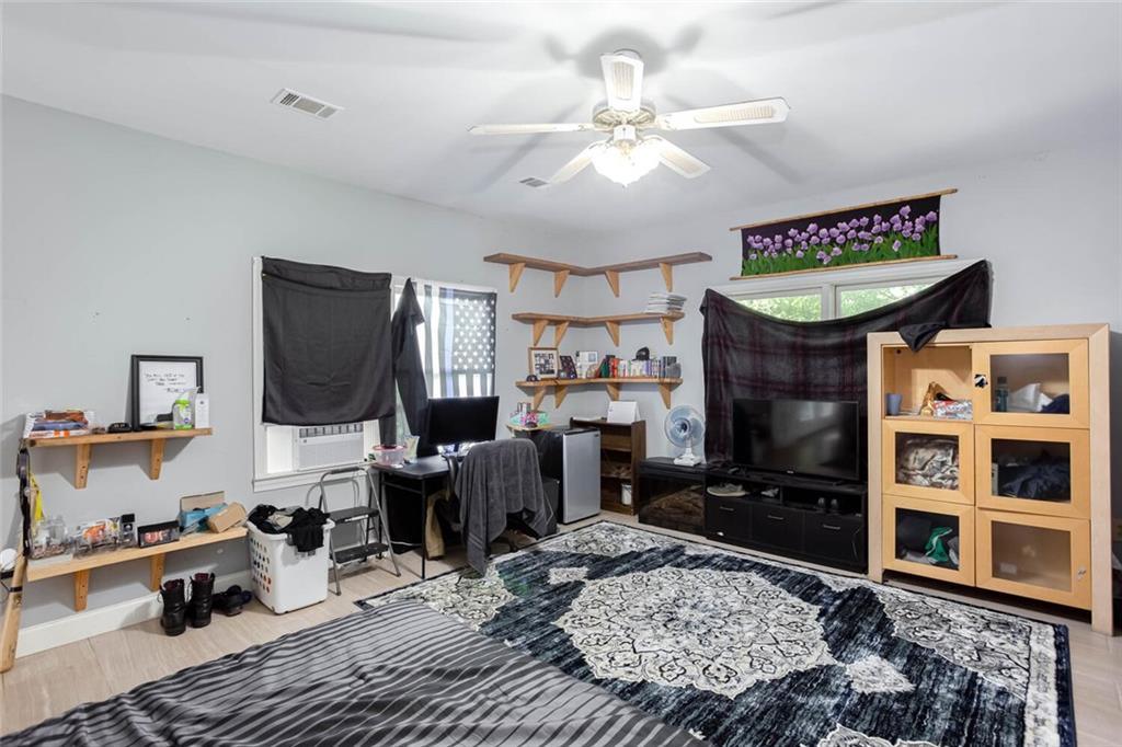 8 Mt Sequoyah Road Jasper, GA 30143 - Photo 47 of 86 a living room with furniture a rug and a fireplace