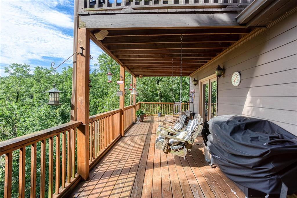 8 Mt Sequoyah Road Jasper, GA 30143 - Photo 52 of 86 a view of balcony with chairs and wooden floor