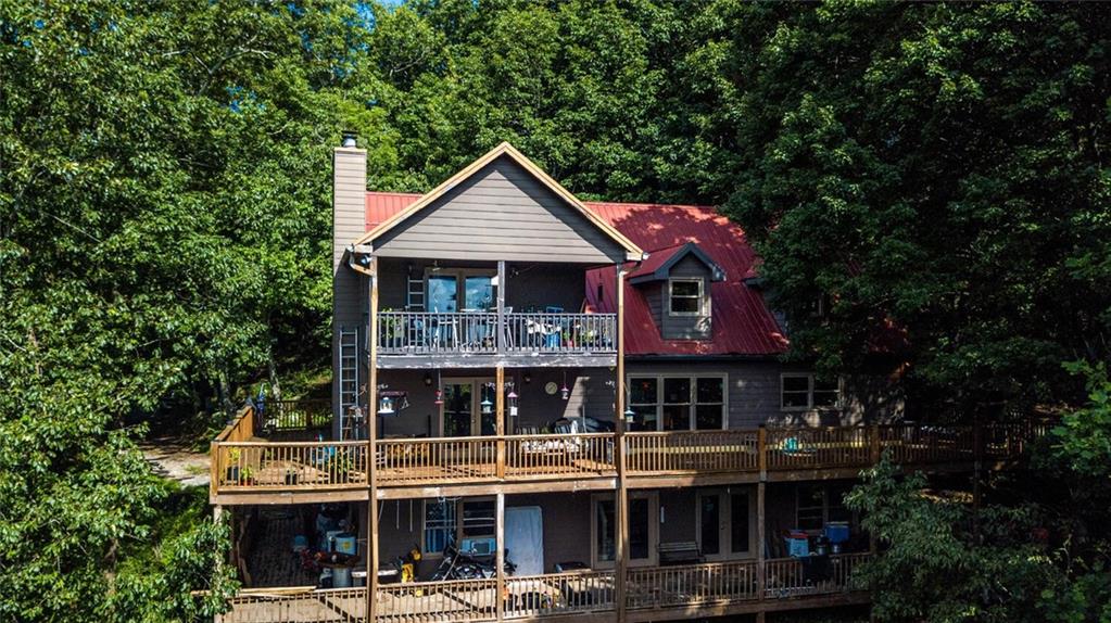 8 Mt Sequoyah Road Jasper, GA 30143 - Photo 67 of 86 a view of small house with large windows and a table and chairs
