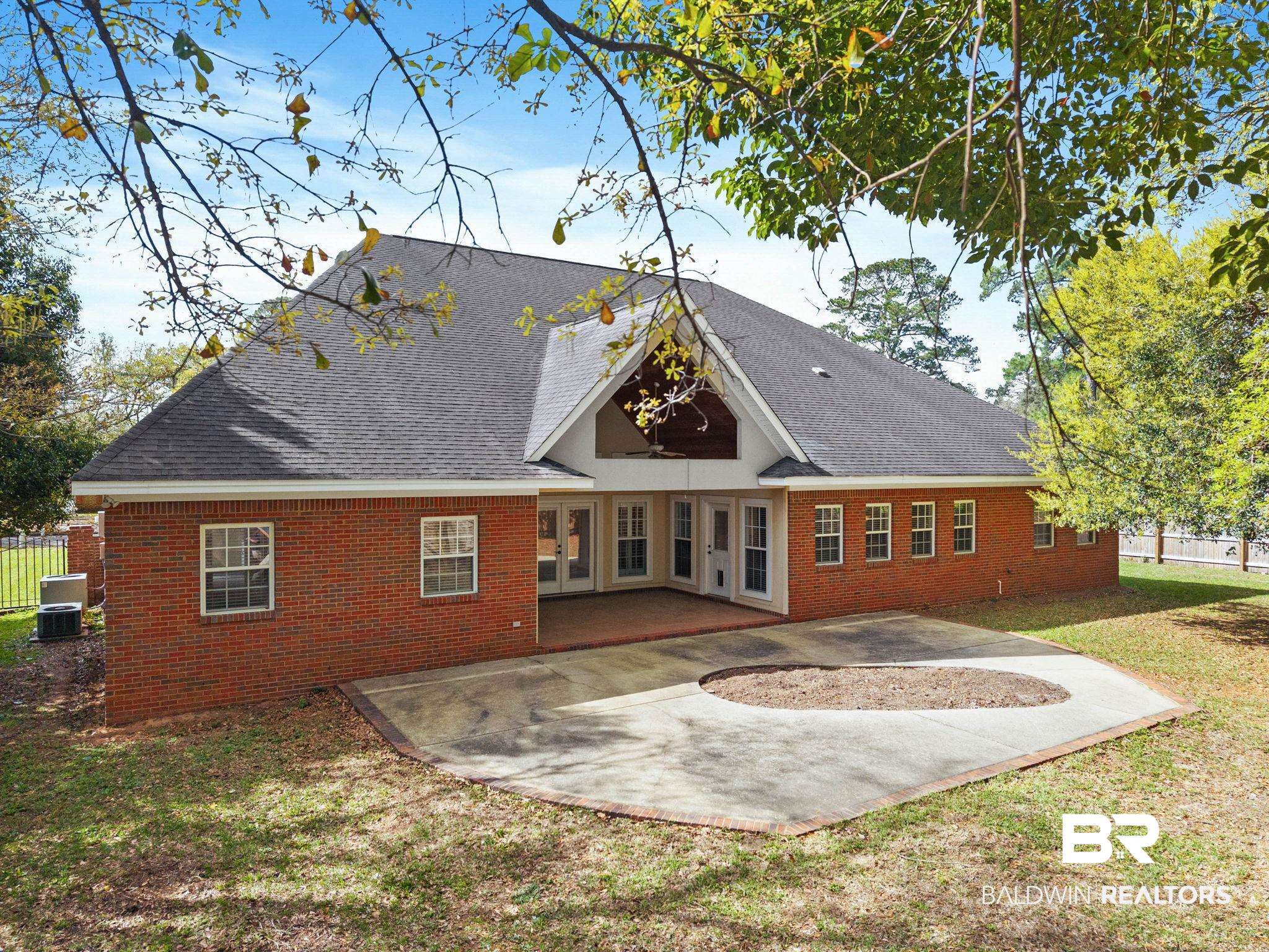 3668 Claridge Road North Mobile, AL 36608 - Photo 86 of 100 Back of house with a patio area, brick siding, and a shingled roof