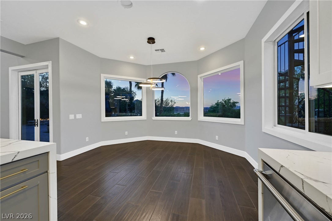 6 Rue Du Ville Henderson, NV 89011 - Photo 36 of 99 This kitchen eating area offers panoramic views, creating an inviting and bright space.