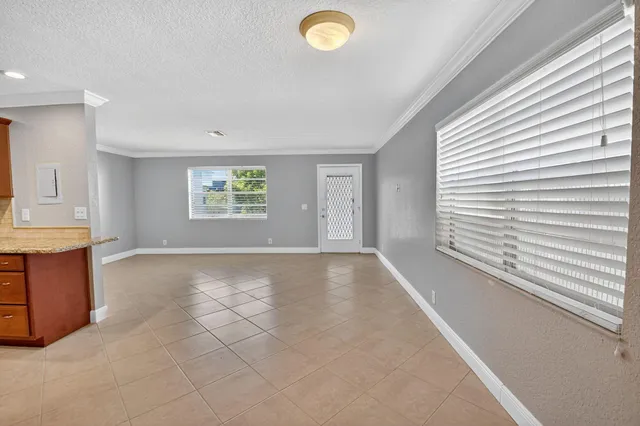 a kitchen with stainless steel appliances granite countertop a refrigerator a stove top oven a sink and dishwasher