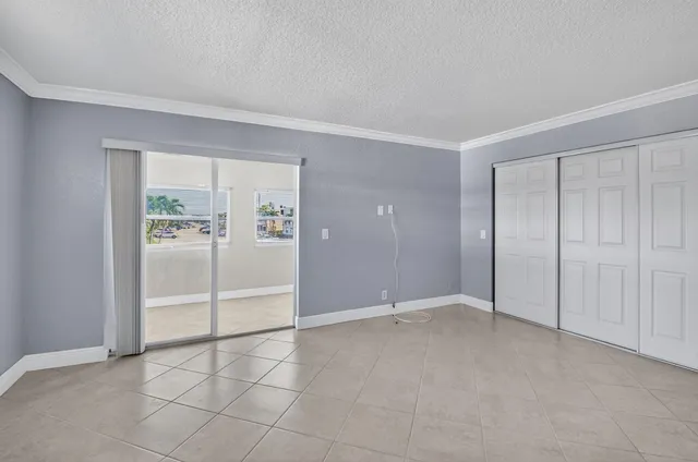 a view of an empty room with windows