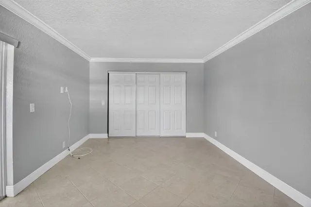 a view of an empty room with windows