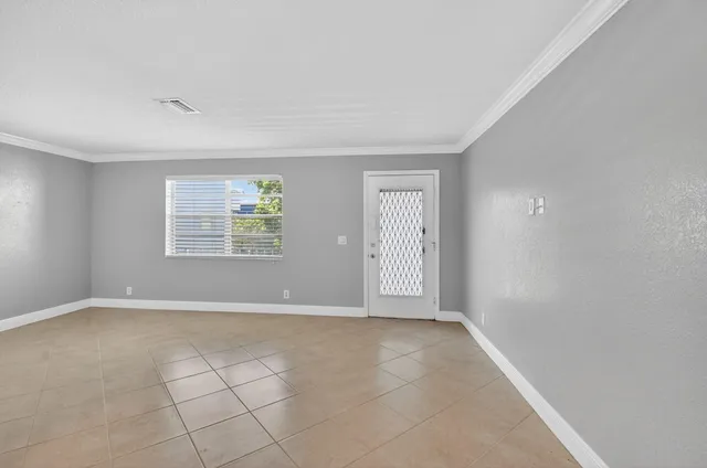 a view of an empty room with a window