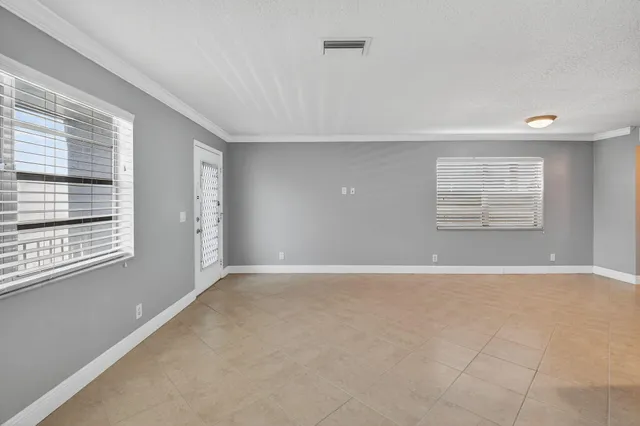 a view of an empty room with a window