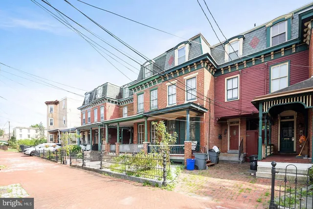 a view of a building with sitting area