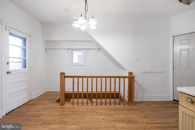 a view of entryway with wooden floor
