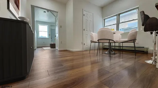 a view of a livingroom with furniture and a window