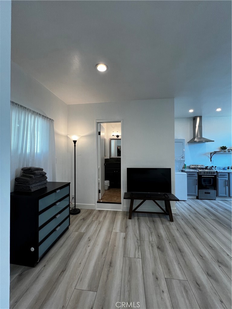 15519 Gramercy Place Gardena, CA 90249 - Photo 3 of 7 a living room with furniture and a wooden floor