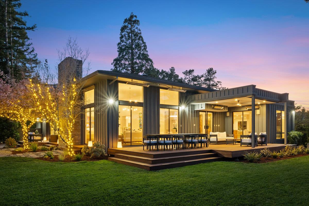 a front view of a house with a yard table and chairs