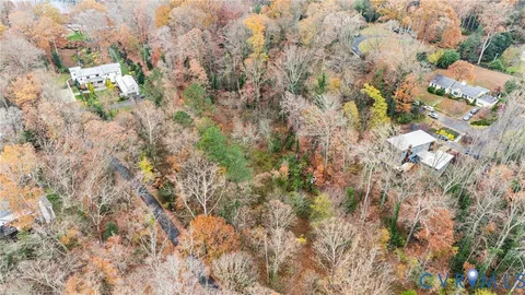 a backyard of a house with lots of trees