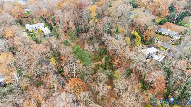 a backyard of a house with lots of trees
