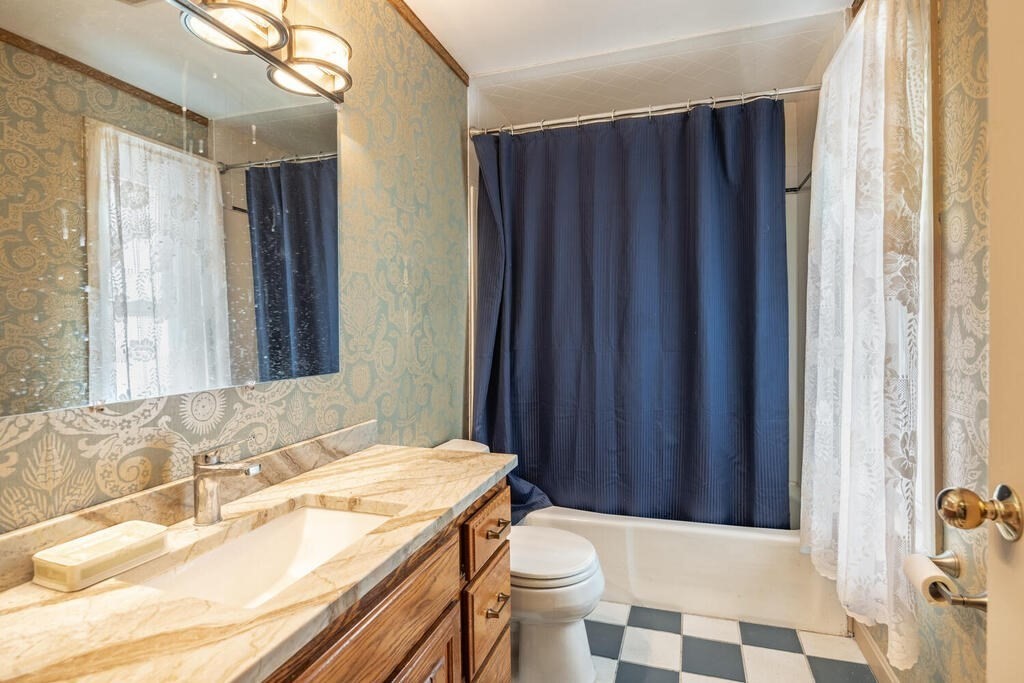 9 Cross Street Somerville, MA 02145 - Photo 13 of 18 a bathroom with a sink and a mirror