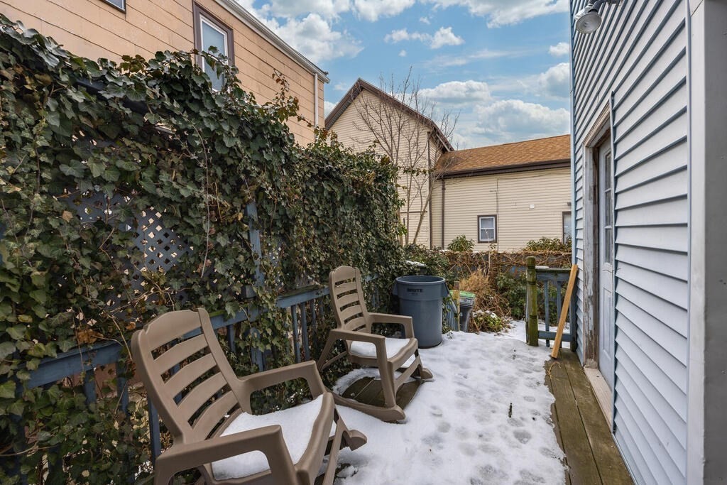 9 Cross Street Somerville, MA 02145 - Photo 17 of 18 a view of a patio with chair and tables back yard of the house