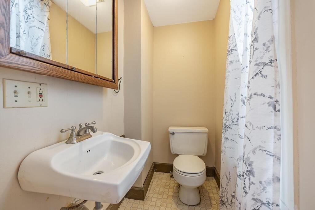 9 Cross Street Somerville, MA 02145 - Photo 6 of 18 a bathroom with a sink and a toilet