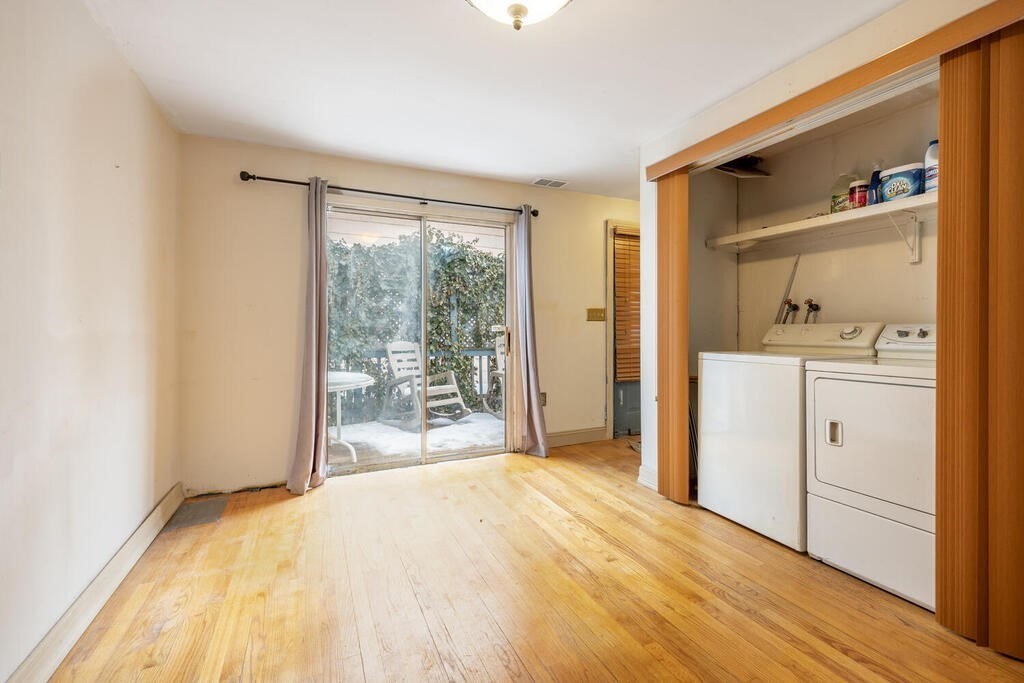 9 Cross Street Somerville, MA 02145 - Photo 7 of 18 a bedroom with a bed and a window