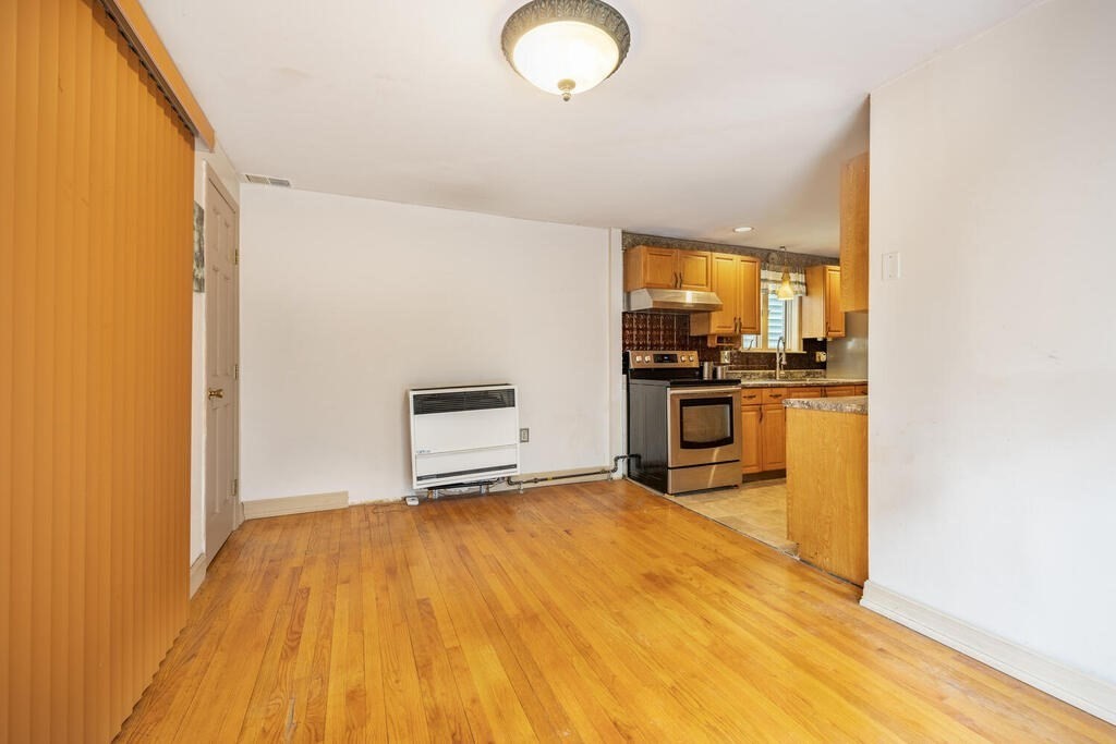 9 Cross Street Somerville, MA 02145 - Photo 8 of 18 a view of a kitchen with a sink and dishwasher wooden floor