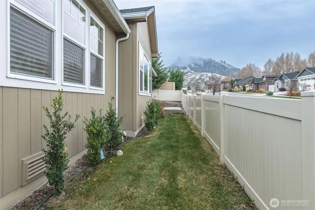 a front view of a house with a yard and a garage