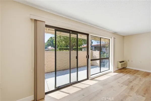 a view of empty room with floor to ceiling window