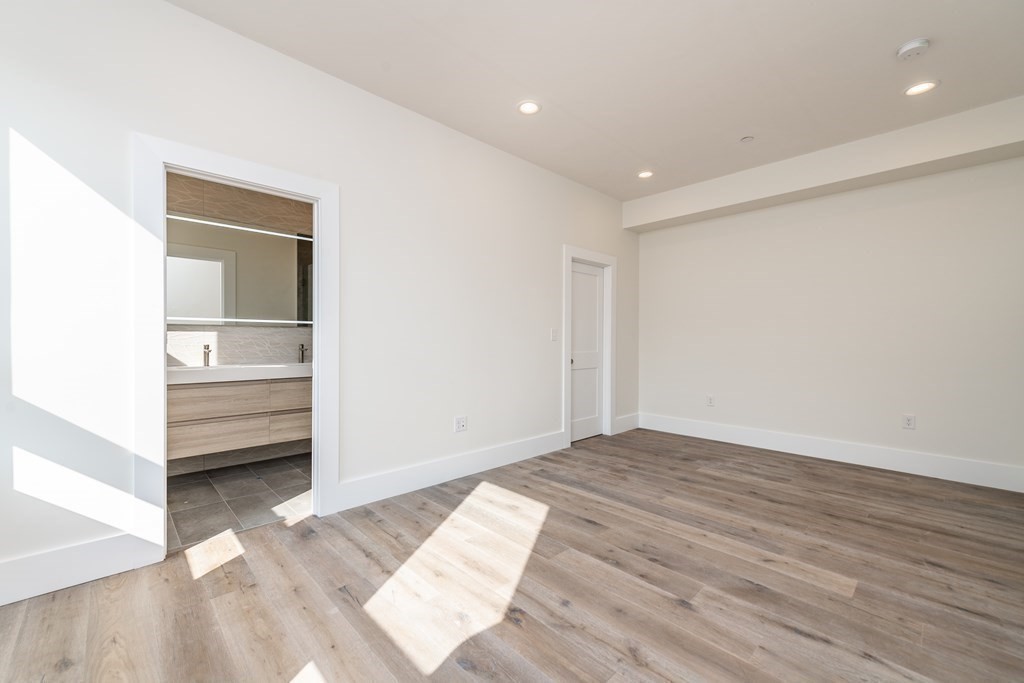 116 School Street, Unit 2 Boston, MA 02119 - Photo 10 of 24 a view of hallway with wooden floor