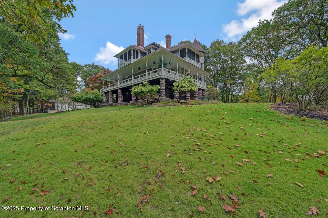 3360 Forest Road Wilkes Barre, PA 18706 - Photo 2 of 88 a view of a big house with a big yard and large trees
