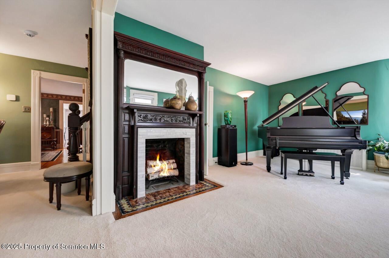 3360 Forest Road Wilkes Barre, PA 18706 - Photo 34 of 88 a living room with furniture a fireplace and a piano