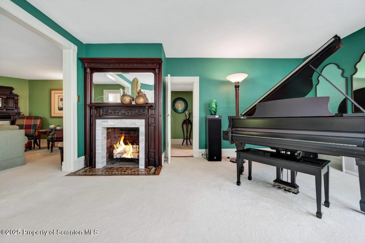 3360 Forest Road Wilkes Barre, PA 18706 - Photo 35 of 88 a living room with furniture and a fireplace