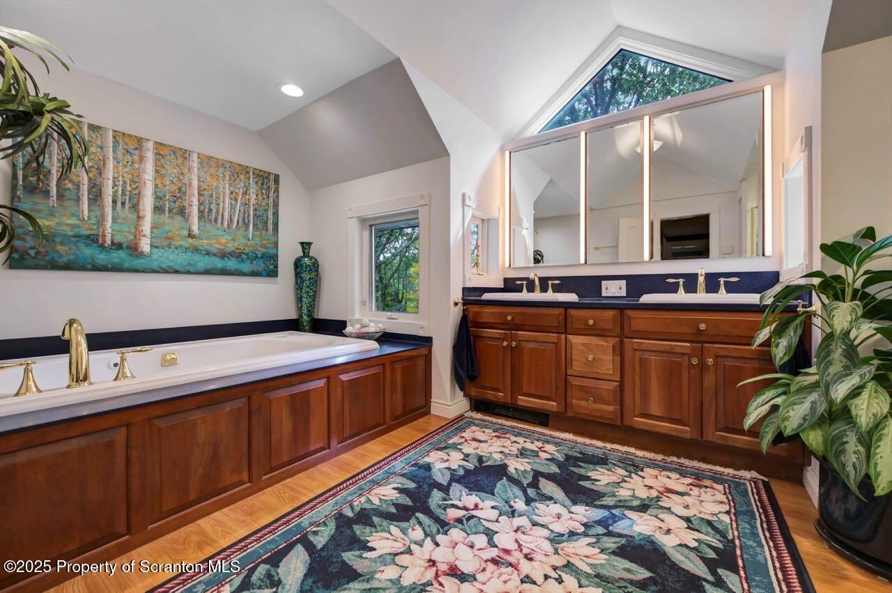 3360 Forest Road Wilkes Barre, PA 18706 - Photo 57 of 88 a kitchen with a stove a sink and a wooden cabinets
