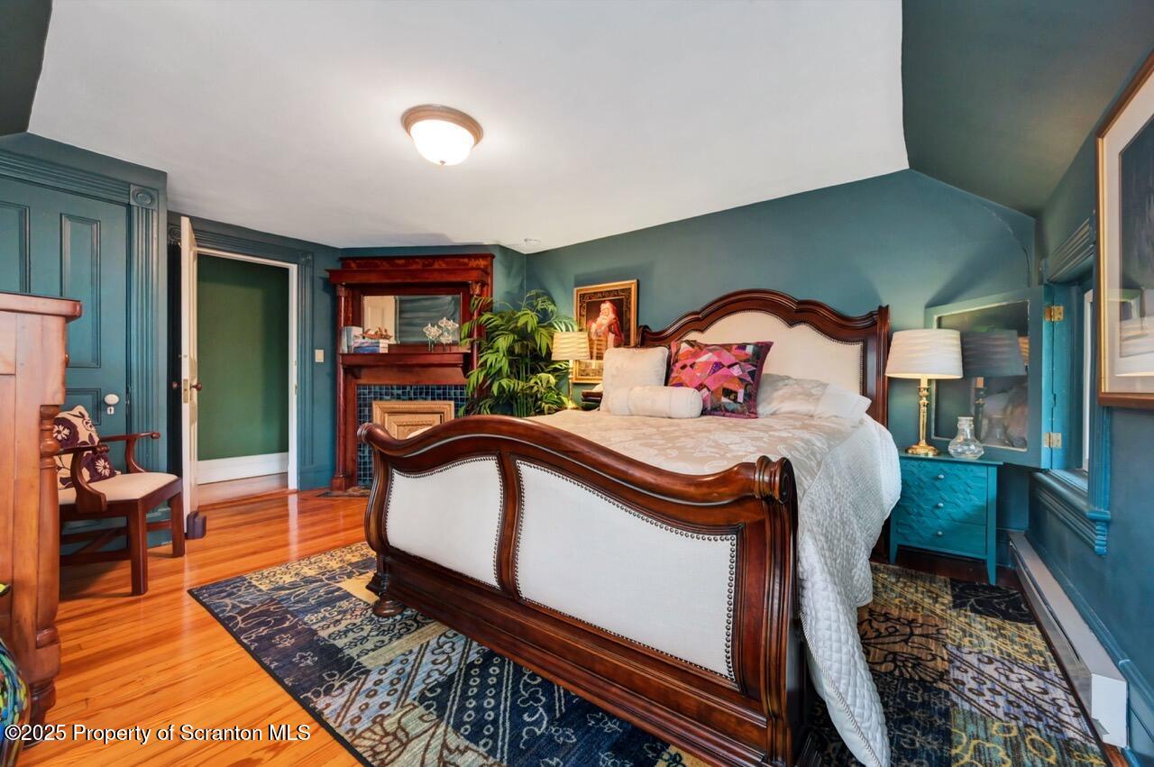3360 Forest Road Wilkes Barre, PA 18706 - Photo 62 of 88 a bedroom with a bed and wooden floor