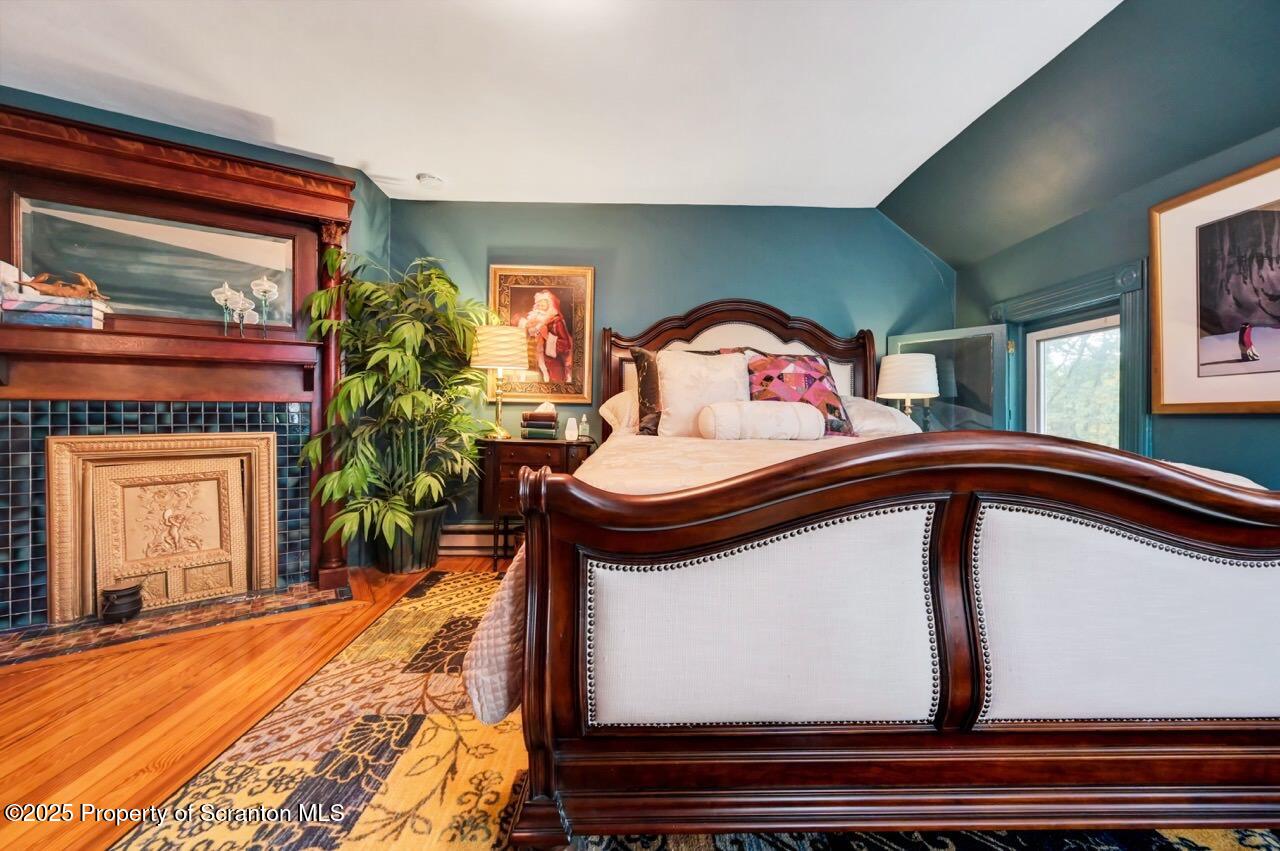 3360 Forest Road Wilkes Barre, PA 18706 - Photo 63 of 88 a bedroom with a bed and a potted plant